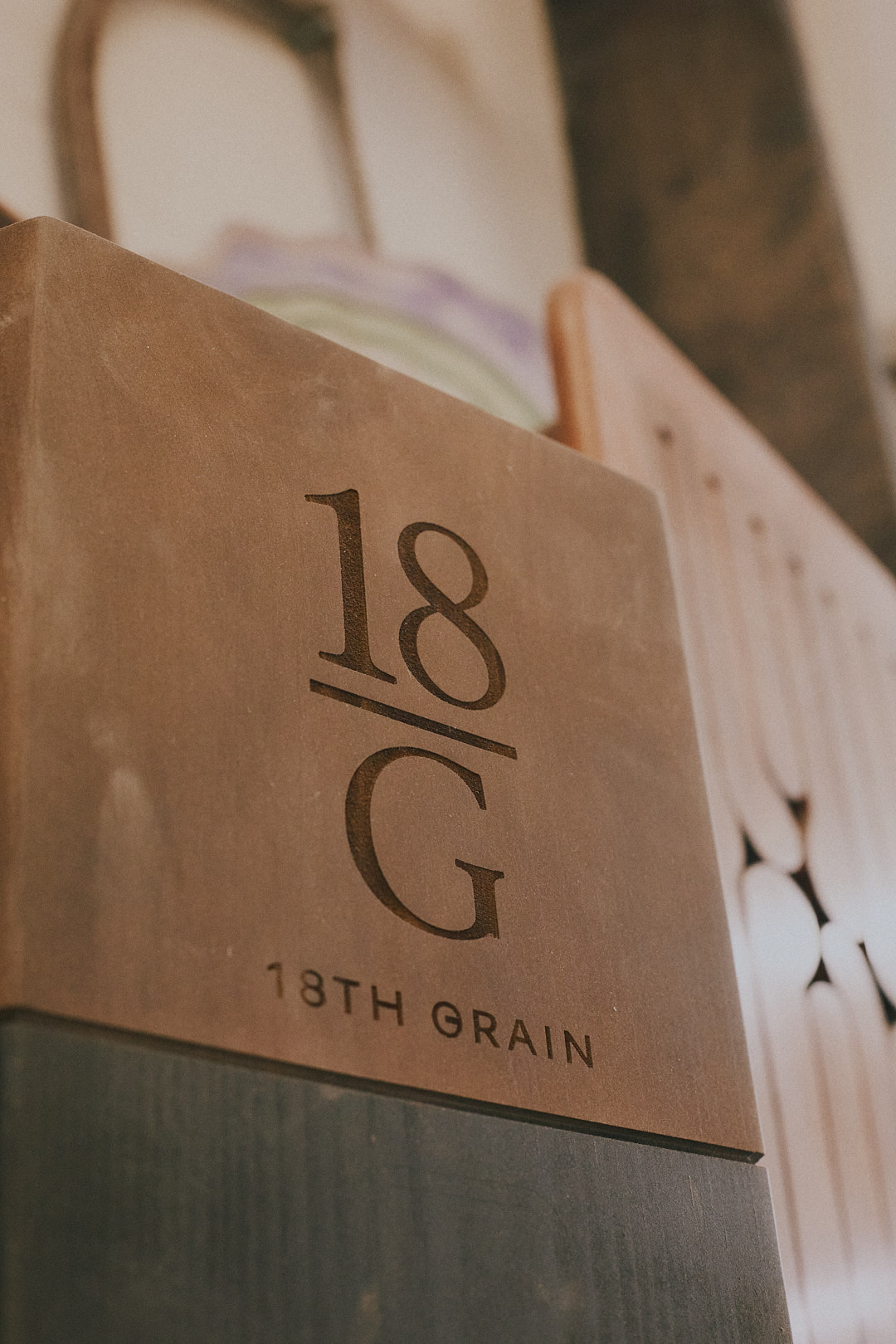 Close detail of a finished 18th Grain branded tee marker.